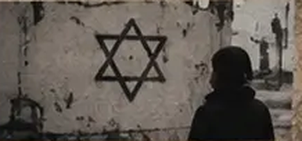 A silhouetted figure beside a Star of David on a wall